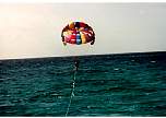 MarkParasailingwithFeetinWater.jpg